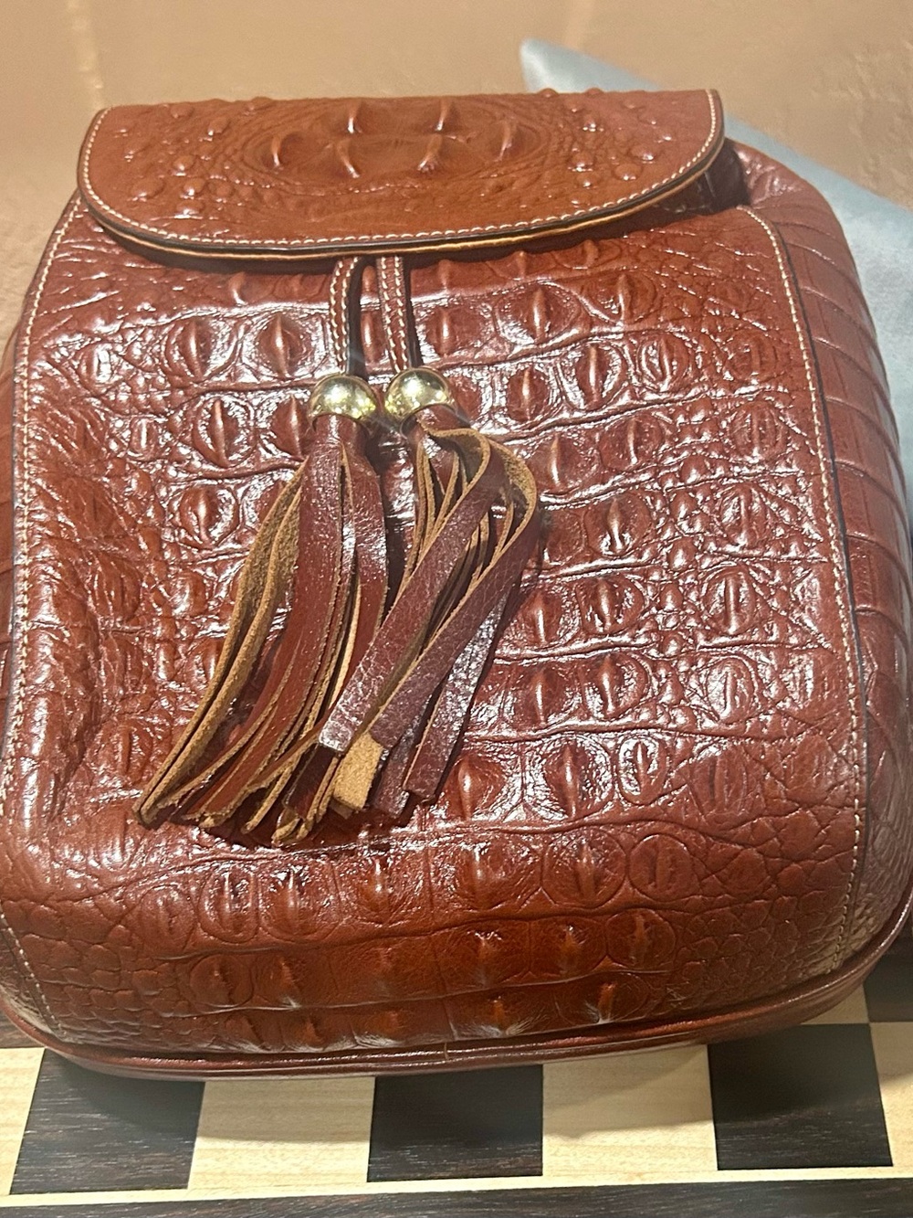 Croc-Embossed Tassel Backpack in Chestnut Brown